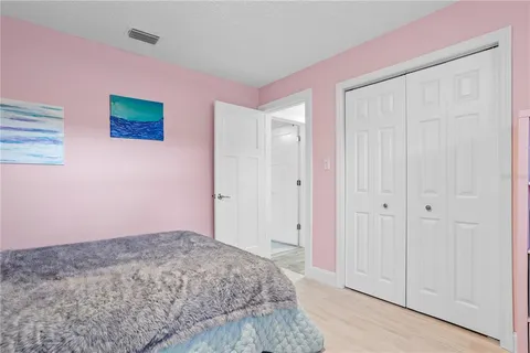 a bedroom with a bed and a shower