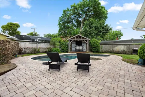 a view of a terrace with sitting area