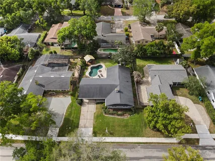 an aerial view of a house with a garden