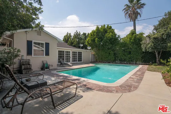 a view of a backyard with a patio