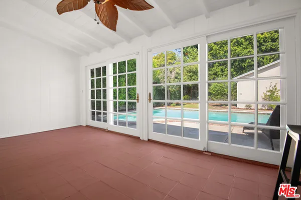 a view of an empty room with a large window