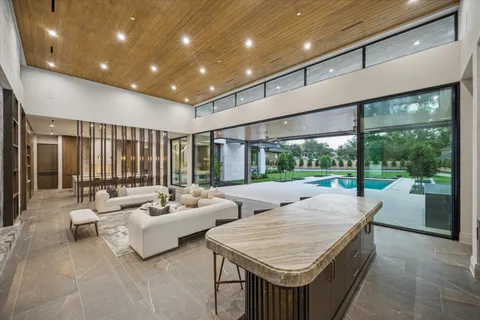 a large kitchen with a table and chairs