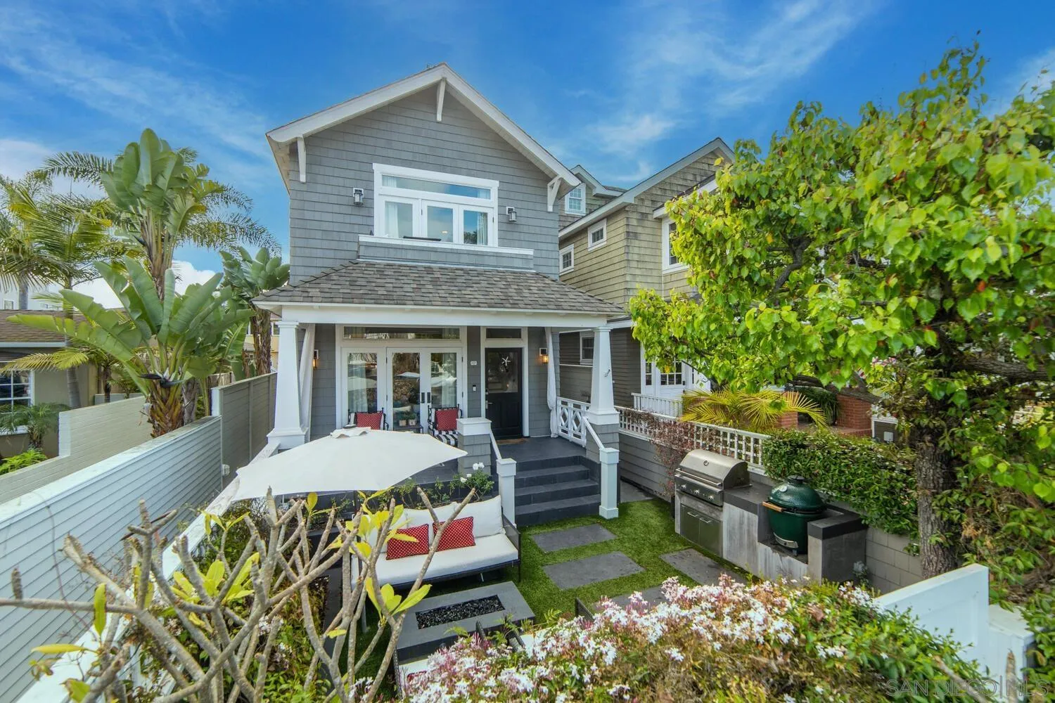 a front view of a house with garden