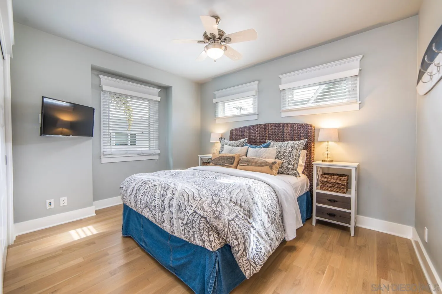 717 G Avenue Coronado, CA 92118 - Photo 12 of 33 a bedroom with a bed and a flat screen tv