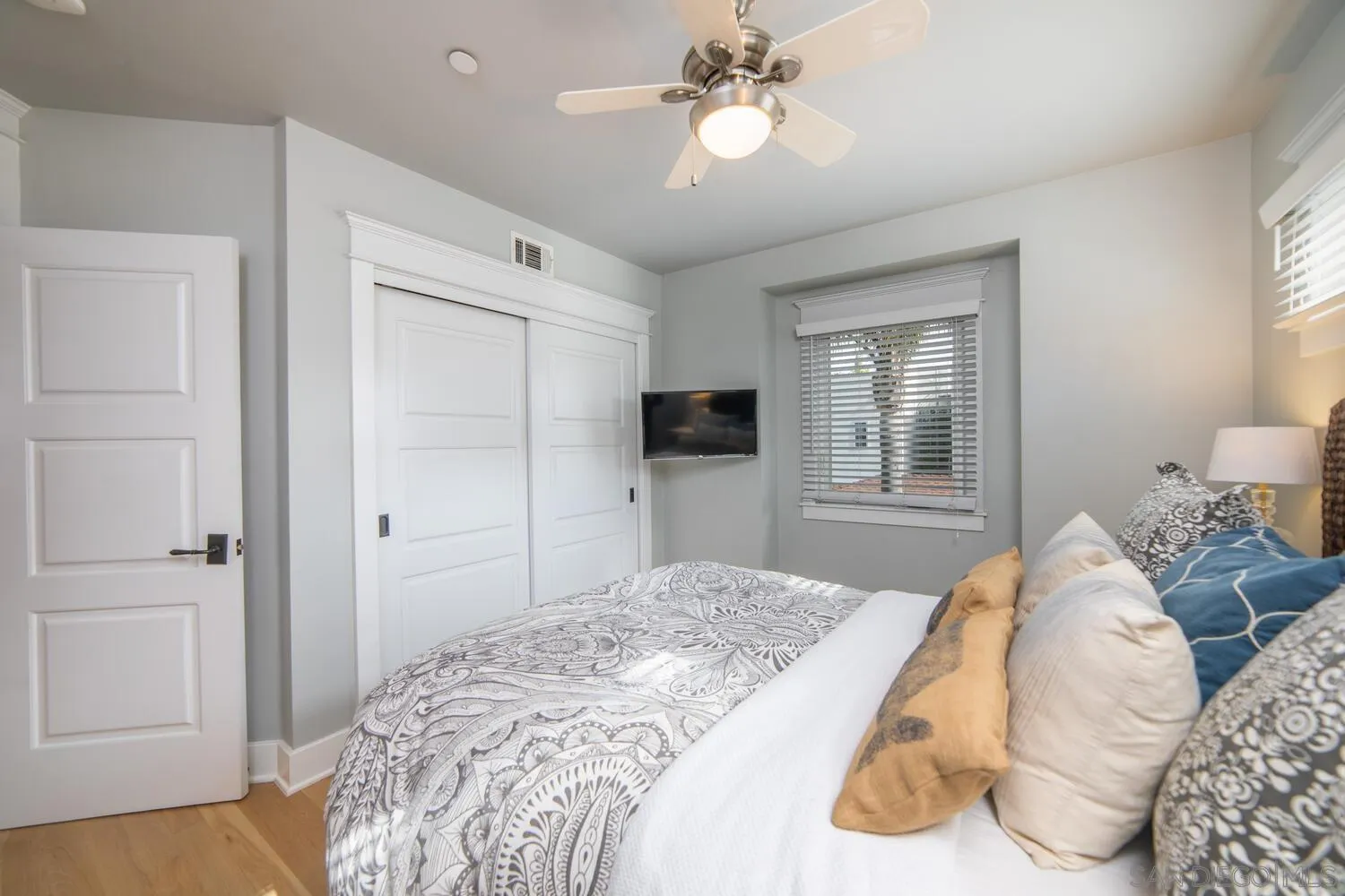 717 G Avenue Coronado, CA 92118 - Photo 13 of 33 a bedroom with a large bed and a window