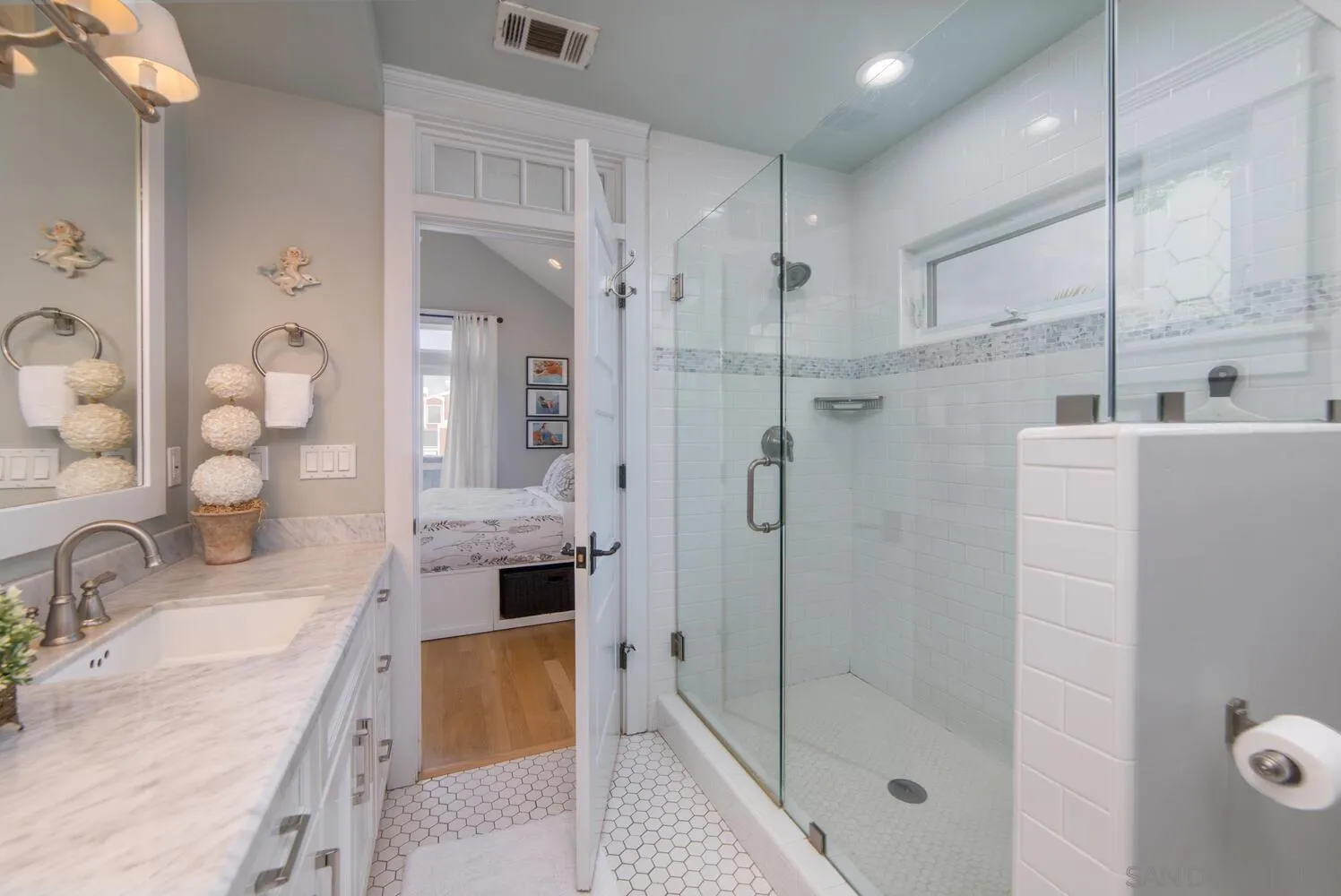 717 G Avenue Coronado, CA 92118 - Photo 20 of 33 a bathroom with a granite countertop bathtub shower sink and mirror