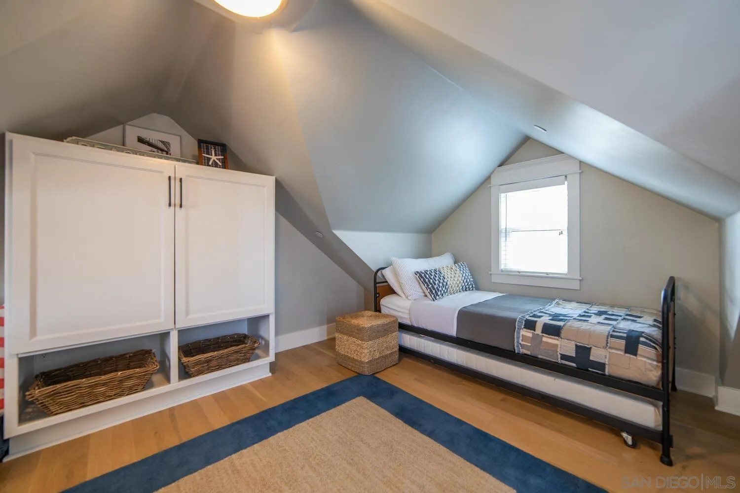717 G Avenue Coronado, CA 92118 - Photo 23 of 33 a living room with furniture and wooden floor