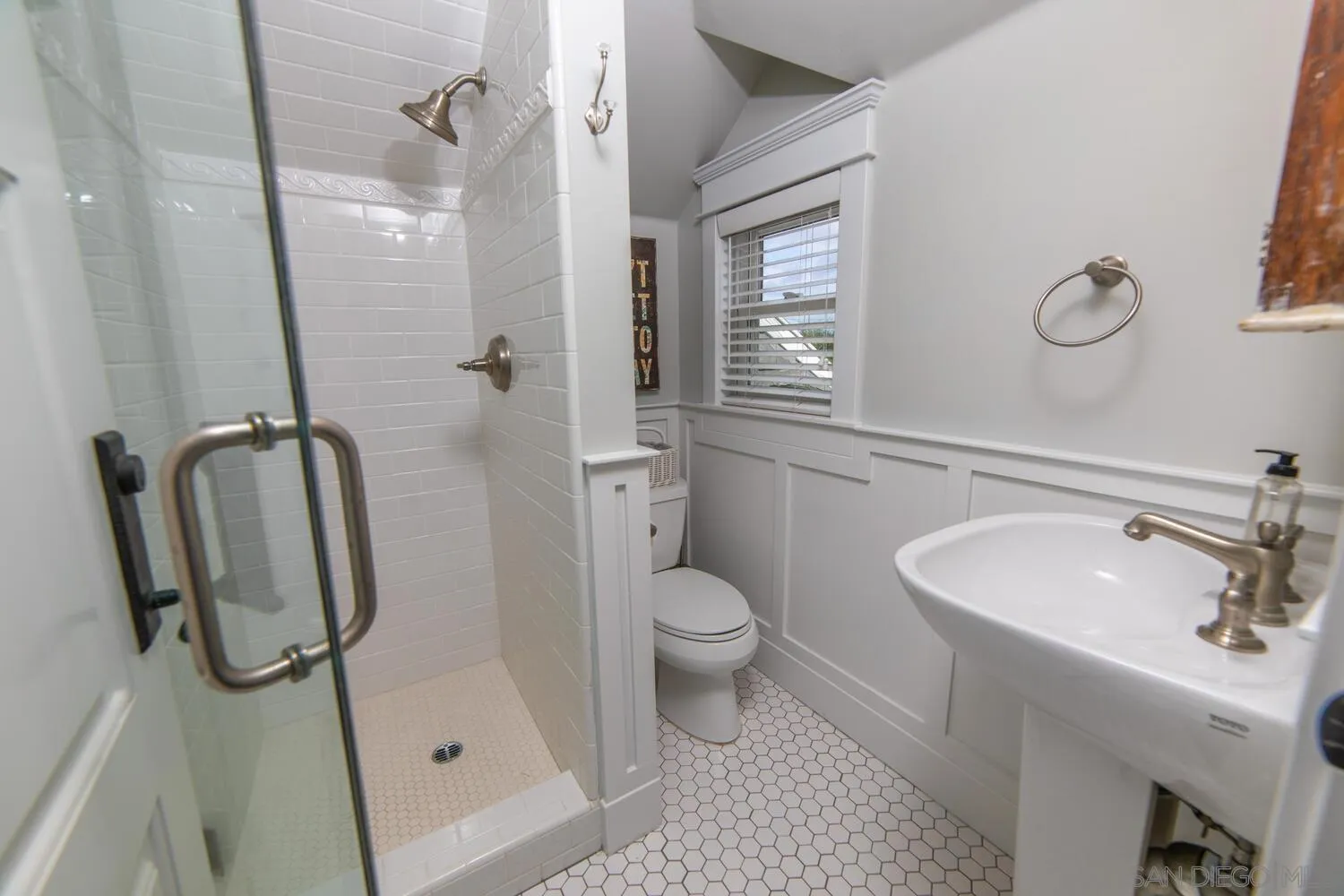 717 G Avenue Coronado, CA 92118 - Photo 24 of 33 a bathroom with a sink a toilet and shower