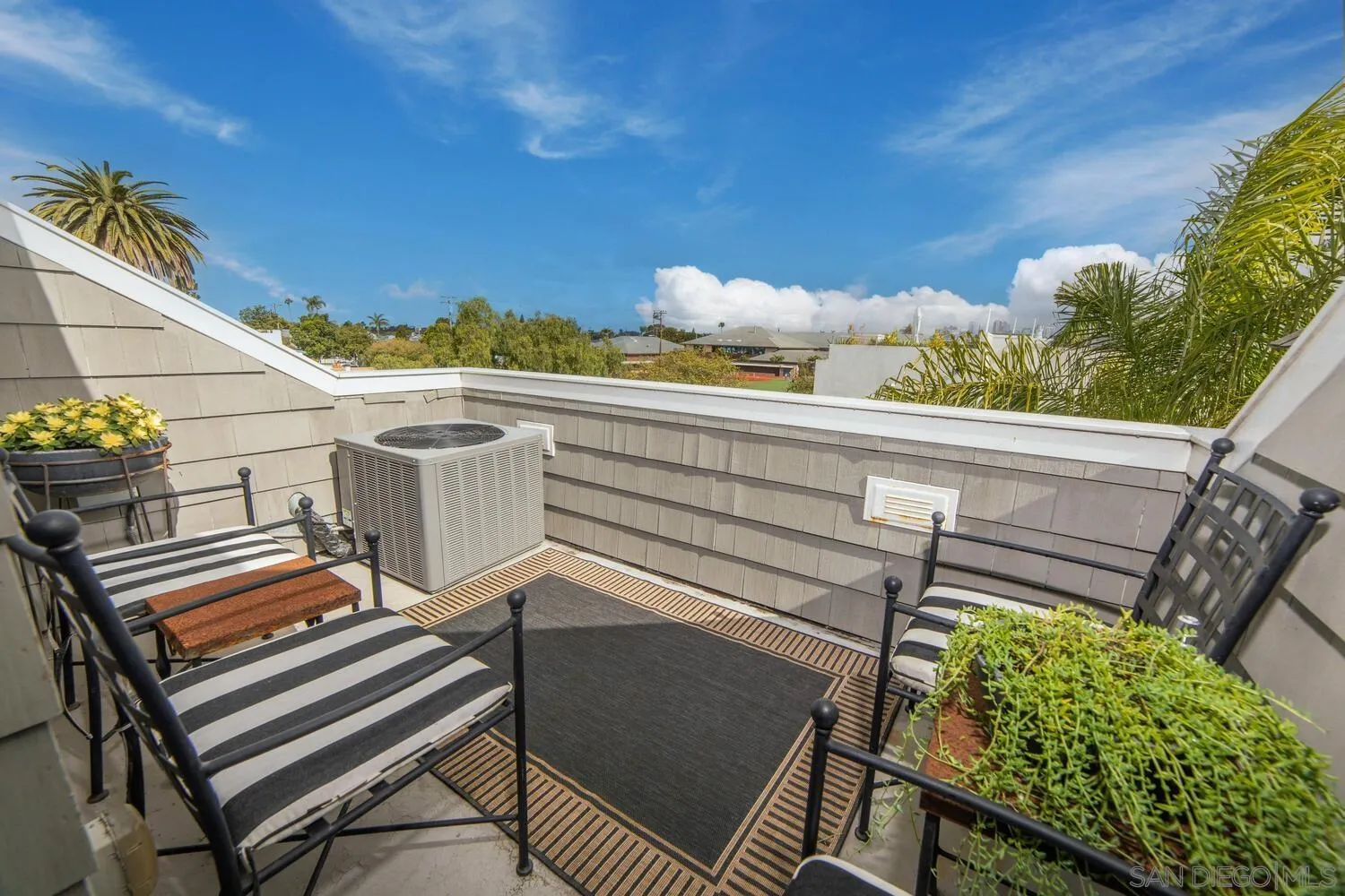 717 G Avenue Coronado, CA 92118 - Photo 25 of 33 a view of a balcony with chairs and wooden fence