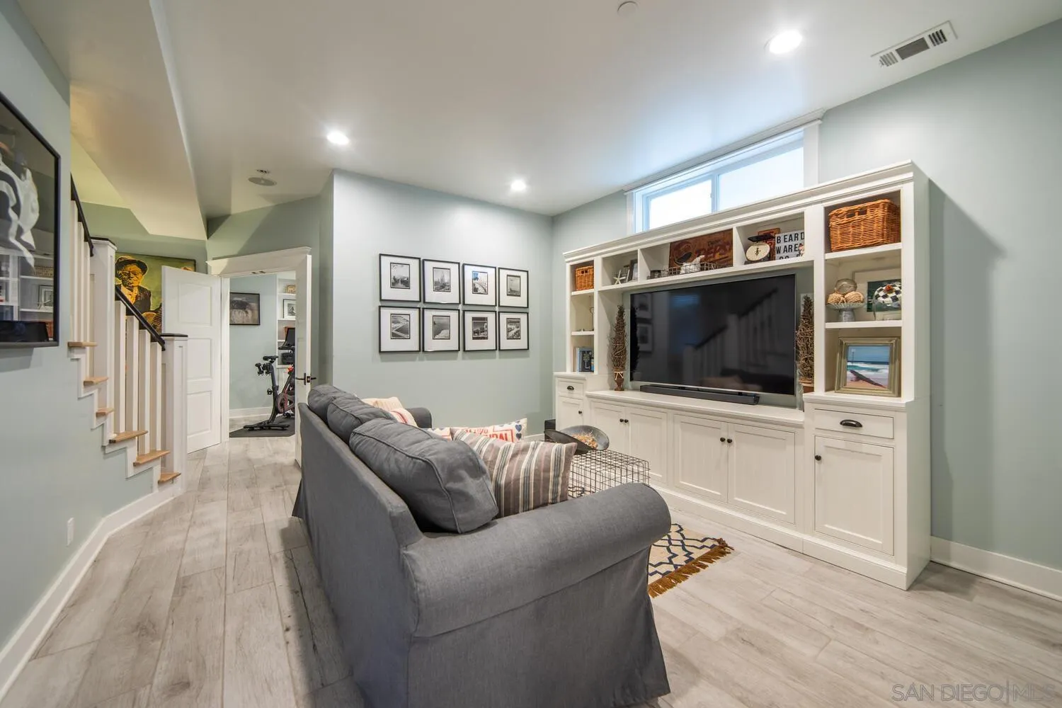 717 G Avenue Coronado, CA 92118 - Photo 28 of 33 a living room with furniture and a flat screen tv