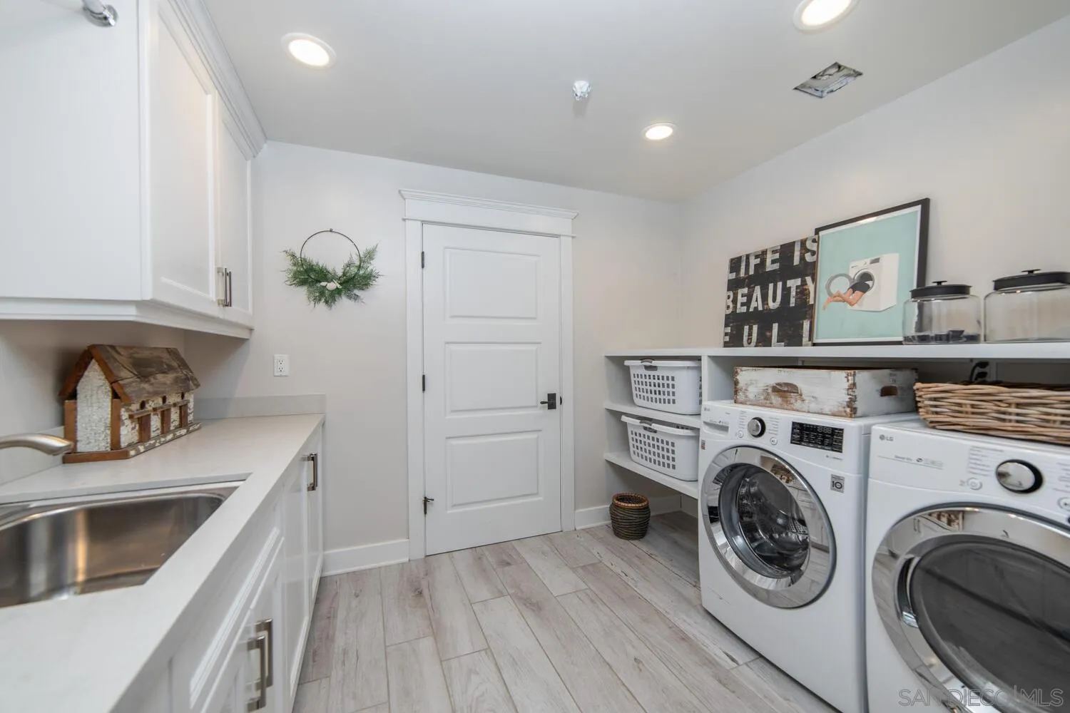 717 G Avenue Coronado, CA 92118 - Photo 30 of 33 a utility room with sink dryer and washer