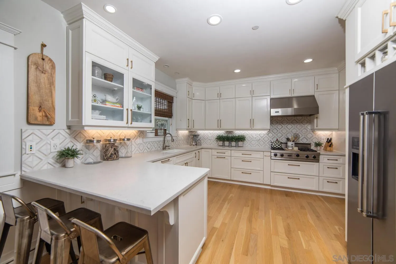 717 G Avenue Coronado, CA 92118 - Photo 8 of 33 a kitchen with a sink appliances and cabinets