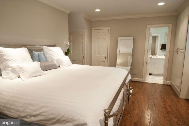105 Goodale Road Baltimore, MD 21212 - Photo 13 of 27 a spacious bedroom with a bed and a wooden floor