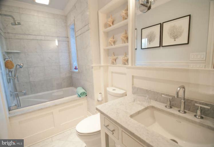 105 Goodale Road Baltimore, MD 21212 - Photo 20 of 27 a bathroom with a sink a toilet and shower