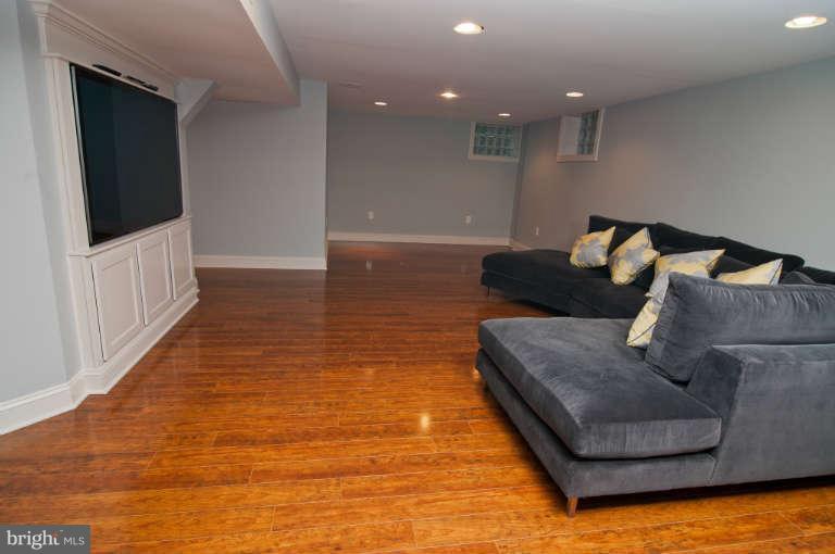 105 Goodale Road Baltimore, MD 21212 - Photo 22 of 27 a living room with furniture and a flat screen tv
