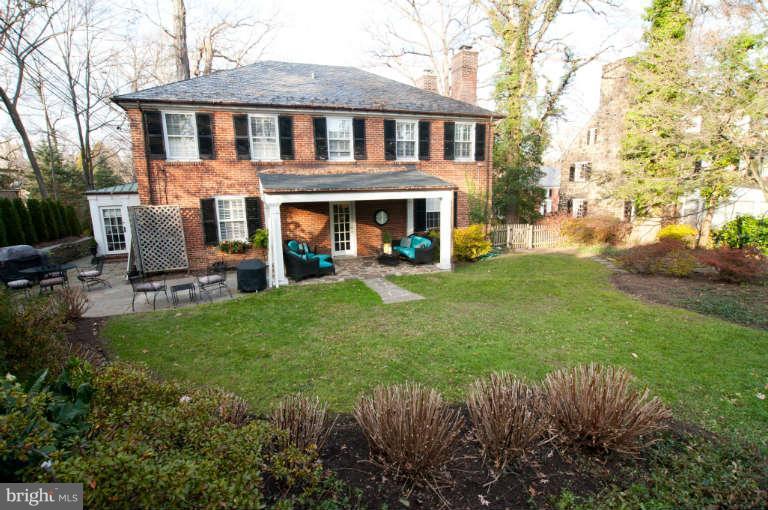 105 Goodale Road Baltimore, MD 21212 - Photo 24 of 27 a front view of a house with a yard table and chairs