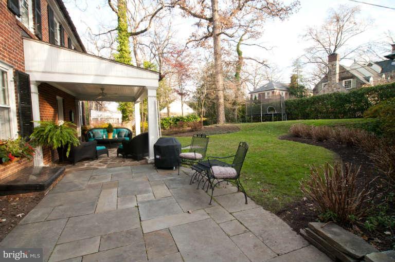 105 Goodale Road Baltimore, MD 21212 - Photo 25 of 27 a view of a patio with table and chairs potted plants and a large tree
