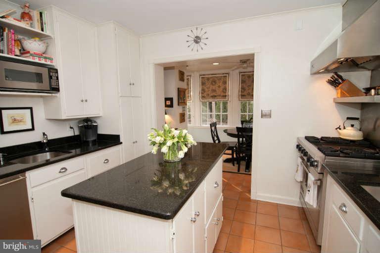 105 Goodale Road Baltimore, MD 21212 - Photo 8 of 27 a kitchen with a stove a sink and a refrigerator