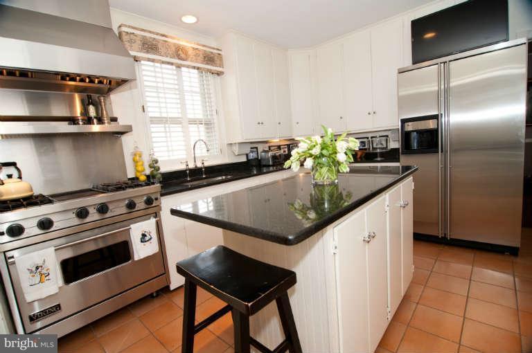 105 Goodale Road Baltimore, MD 21212 - Photo 9 of 27 a kitchen with stainless steel appliances granite countertop a sink a stove and a refrigerator