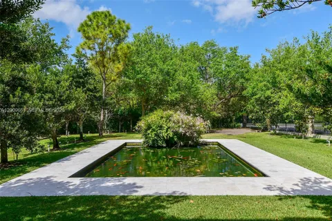a view of swimming pool with a sitting area