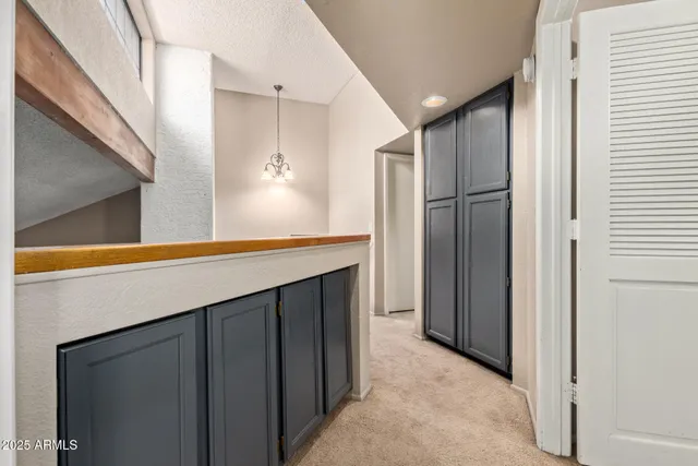 a kitchen with stainless steel appliances a refrigerator and cabinets