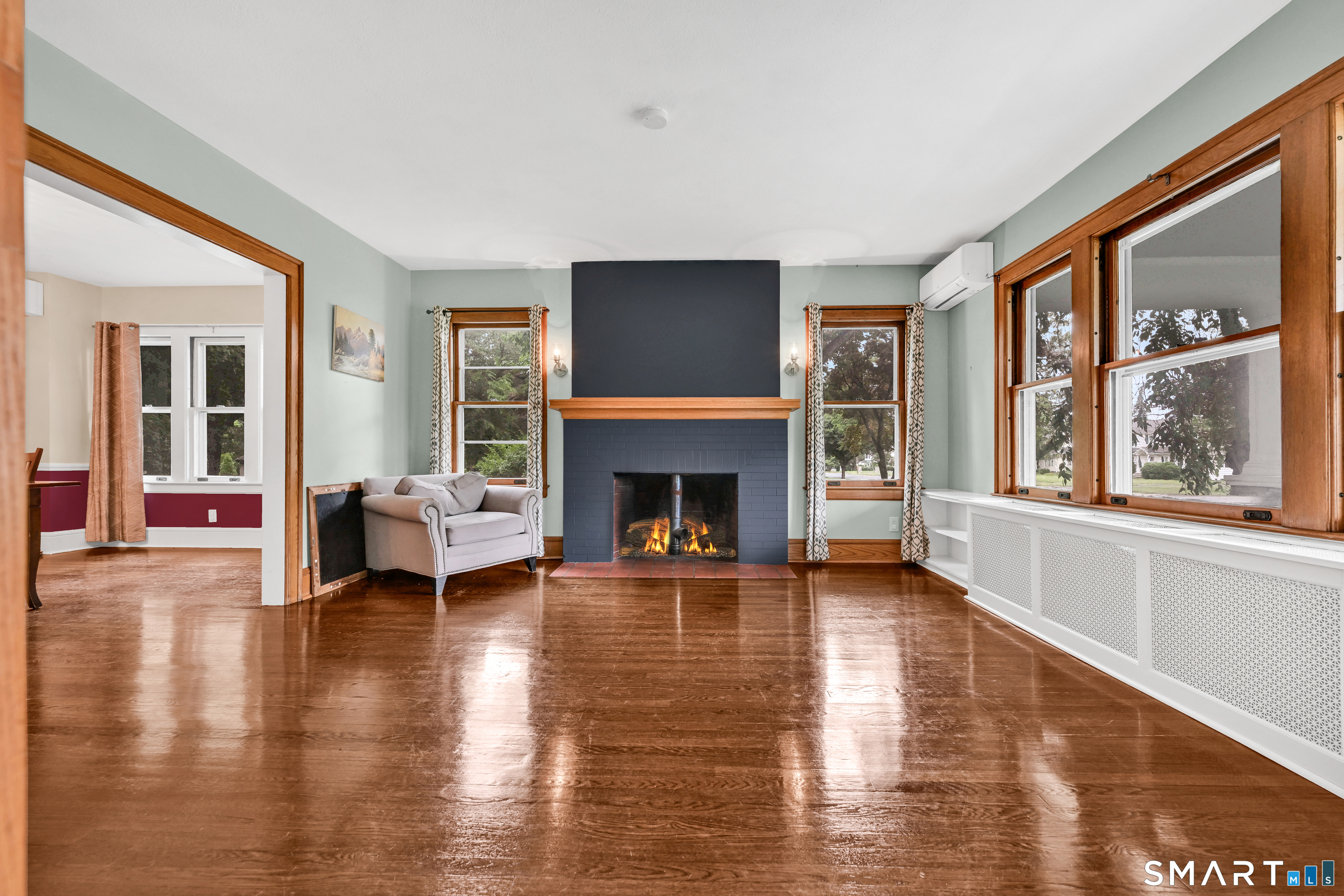 295 Wolcott Hill Road Wethersfield, CT 06109 - Photo 5 of 40 Stunning fireplace and hardwood floors in the formal living room