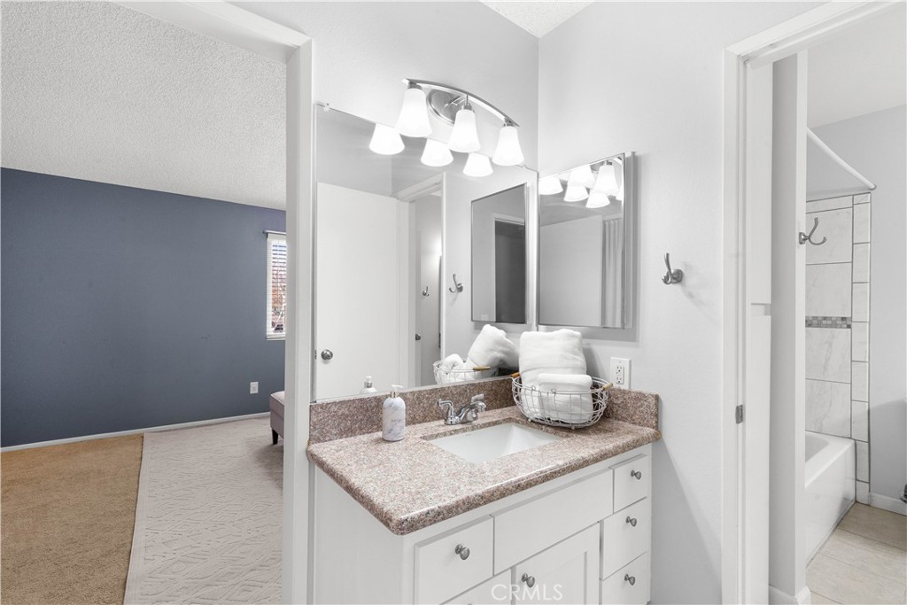 710 Tocino Drive Duarte, CA 91010 - Photo 8 of 11 a bathroom with a sink vanity and mirror