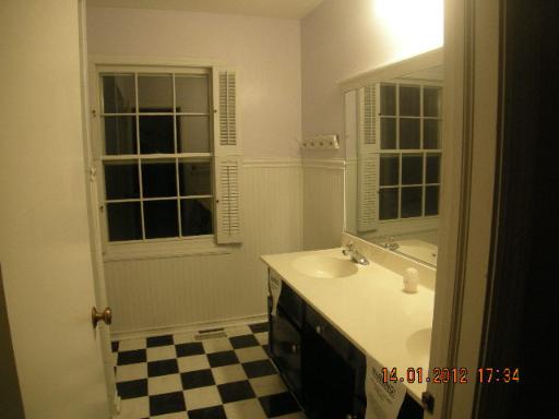 100 Indian Road Lake Bluff, IL 60044 - Photo 8 of 9 a bathroom with a sink and a mirror