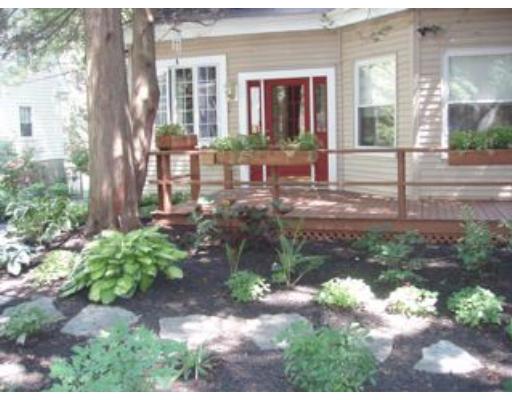 157 Clark Road Brookline, MA 02445 - Photo 17 of 21 a front view of a house with garden