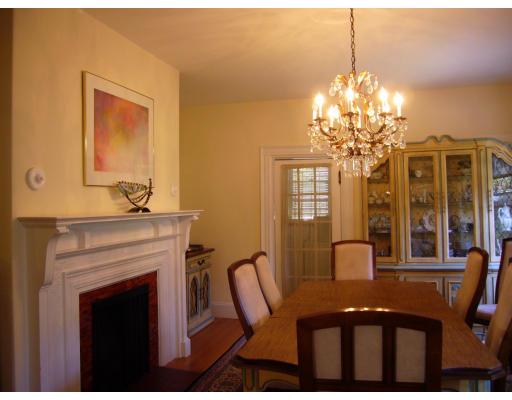 157 Clark Road Brookline, MA 02445 - Photo 4 of 21 a view of a dining room with furniture a chandelier and window