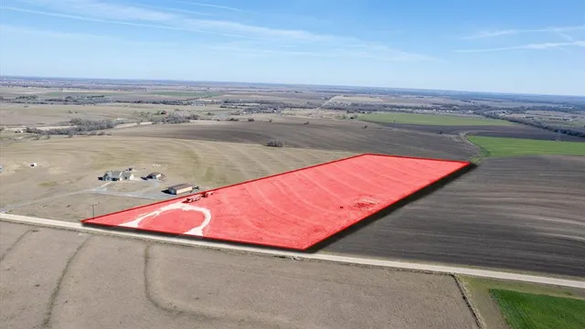 an aerial view of an ocean and beach