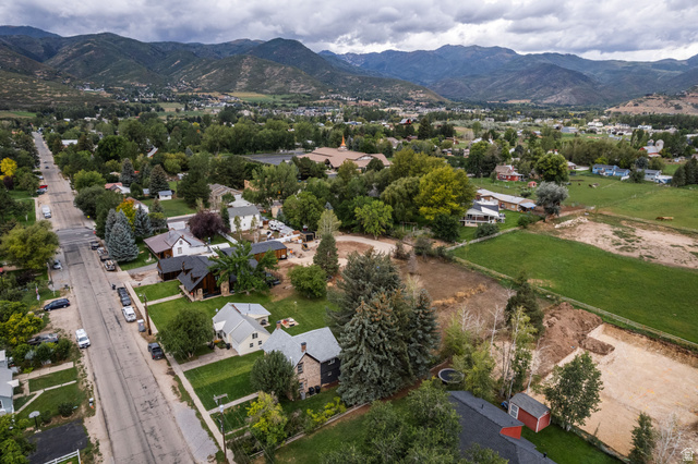 75 East 100 North Midway, UT 84049 - Photo 41 of 43 Expansive neighborhood with mature trees, green lawns, and distant mountains