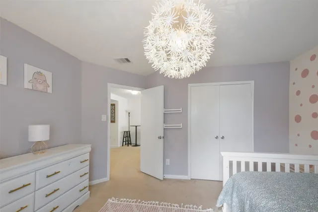 a view of a hallway to a bedroom