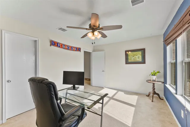 a workspace with furniture and a window