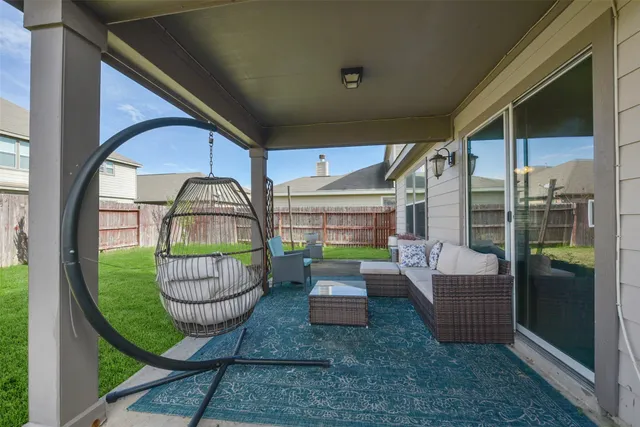 a view of a house with a yard and sitting area