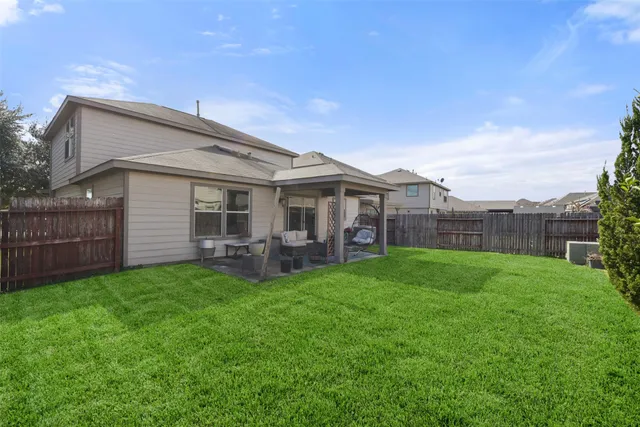 a view of a house with a yard porch and a garden