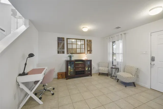 a bedroom with furniture and a window
