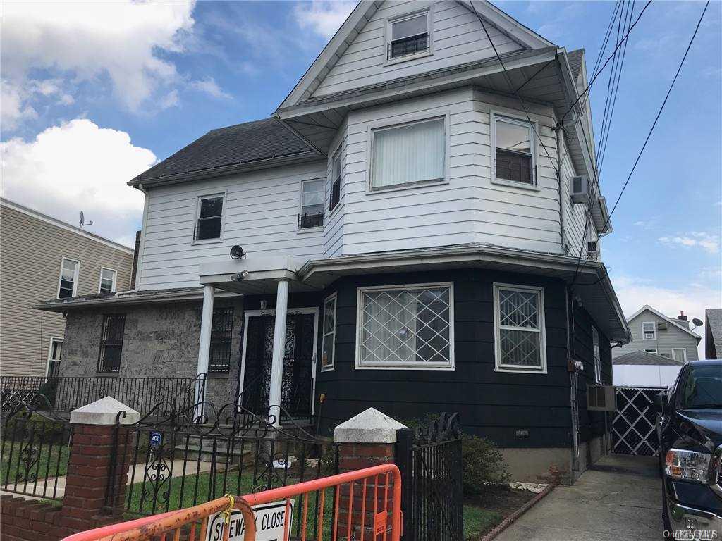 a front view of a house with glass windows