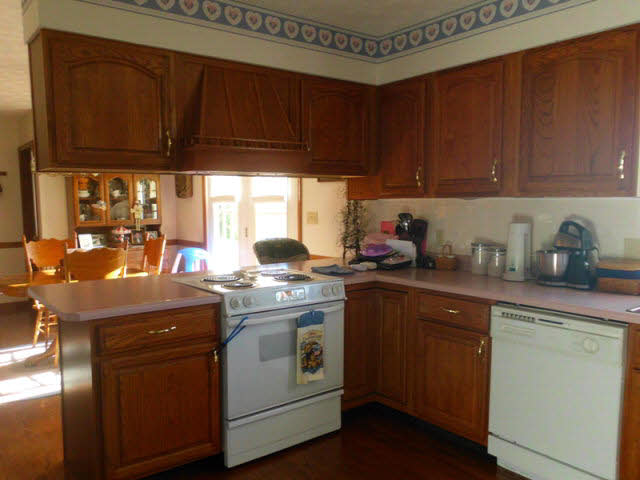 148 Millers Road Bridgewater, VA 22812 - Photo 9 of 20 a kitchen with a sink a stove cabinets and a window