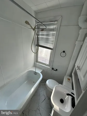 a bathroom with a sink and toilet
