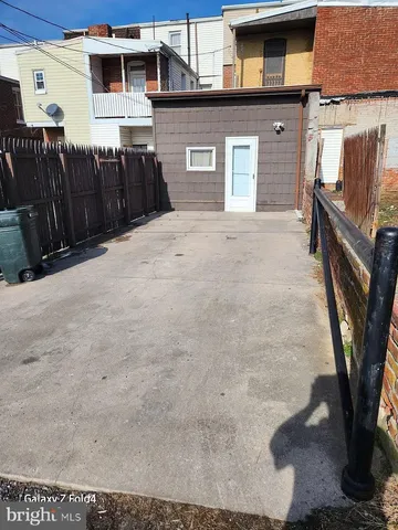 a view of a house with a backyard space