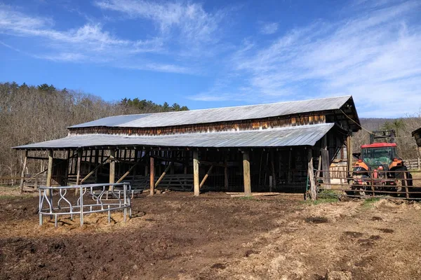 a view of a house with backyard porch and sitting area