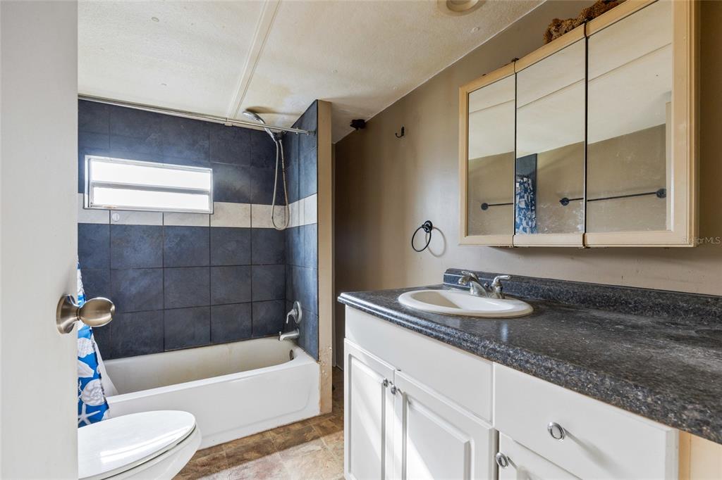 2780 County Road 575 Bushnell, FL 33513 - Photo 14 of 57 a bathroom with a sink a bathtub and a shower
