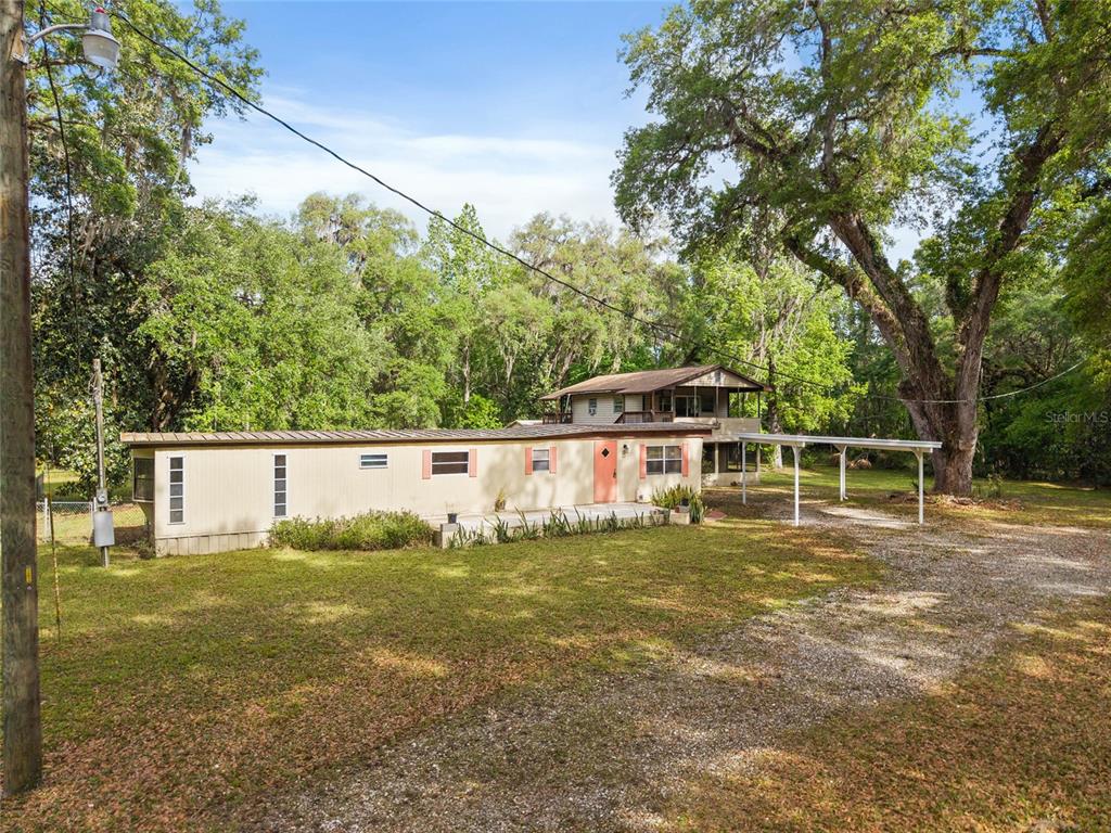 2780 County Road 575 Bushnell, FL 33513 - Photo 19 of 57 a view of a house with yard
