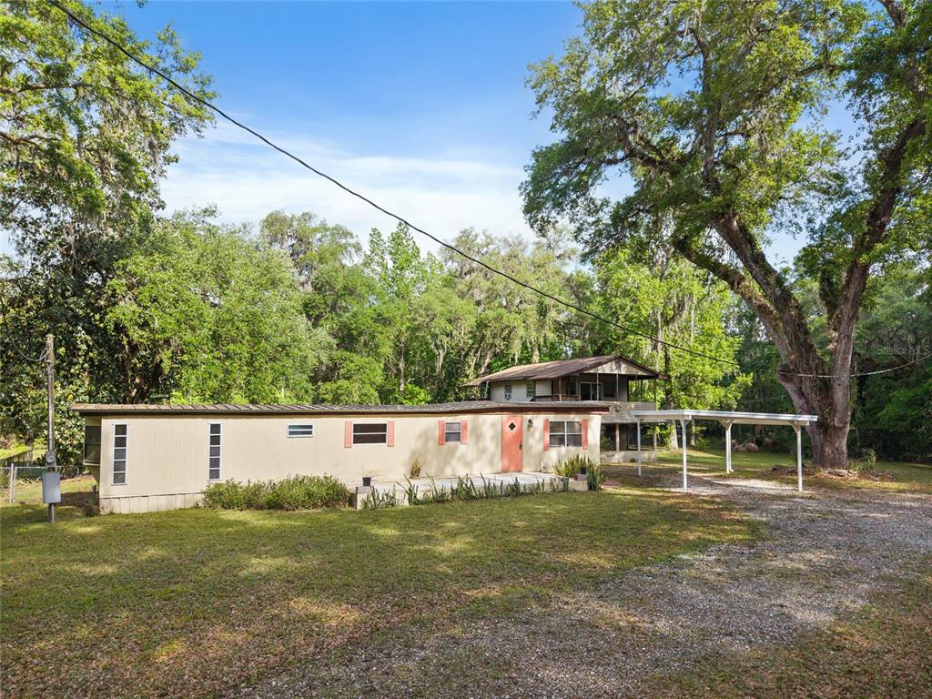 2780 County Road 575 Bushnell, FL 33513 - Photo 20 of 57 a view of a house with a yard