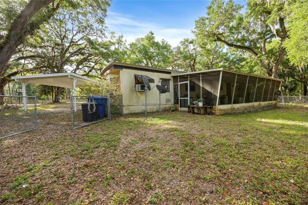 2780 County Road 575 Bushnell, FL 33513 - Photo 24 of 57 a view of a house with backyard