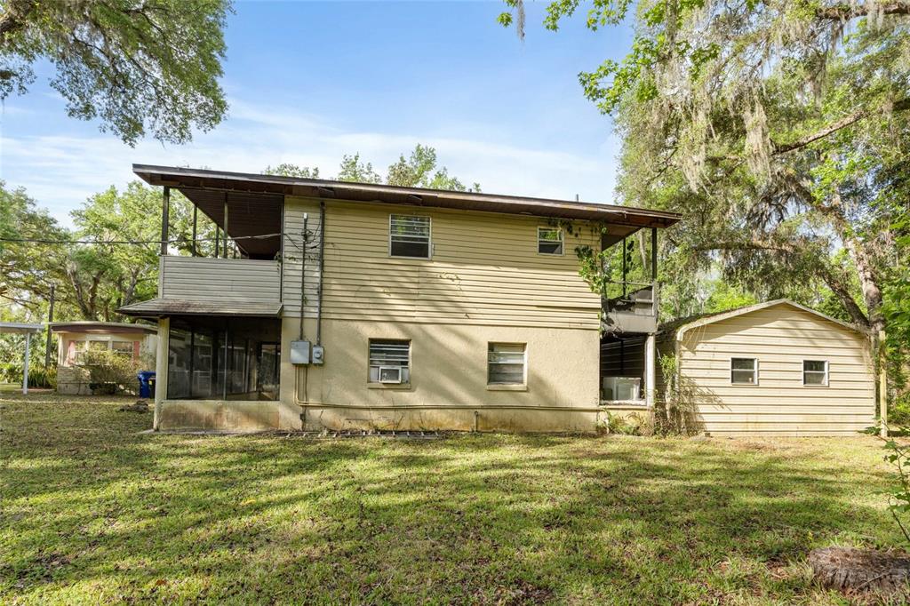 2780 County Road 575 Bushnell, FL 33513 - Photo 25 of 57 a view of a house with a yard