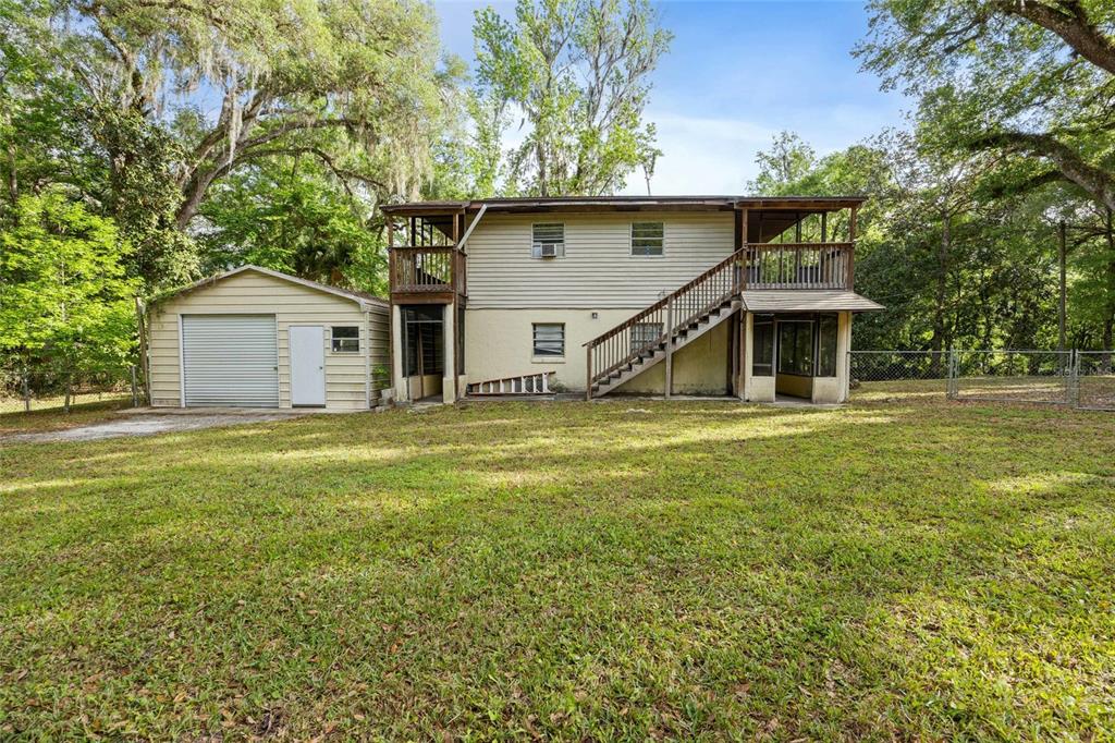 2780 County Road 575 Bushnell, FL 33513 - Photo 26 of 57 a front view of a house with a garden