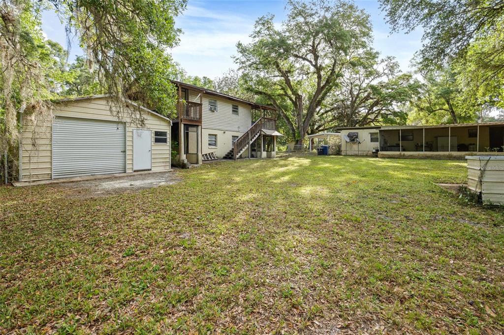 2780 County Road 575 Bushnell, FL 33513 - Photo 27 of 57 a view of a backyard with large trees