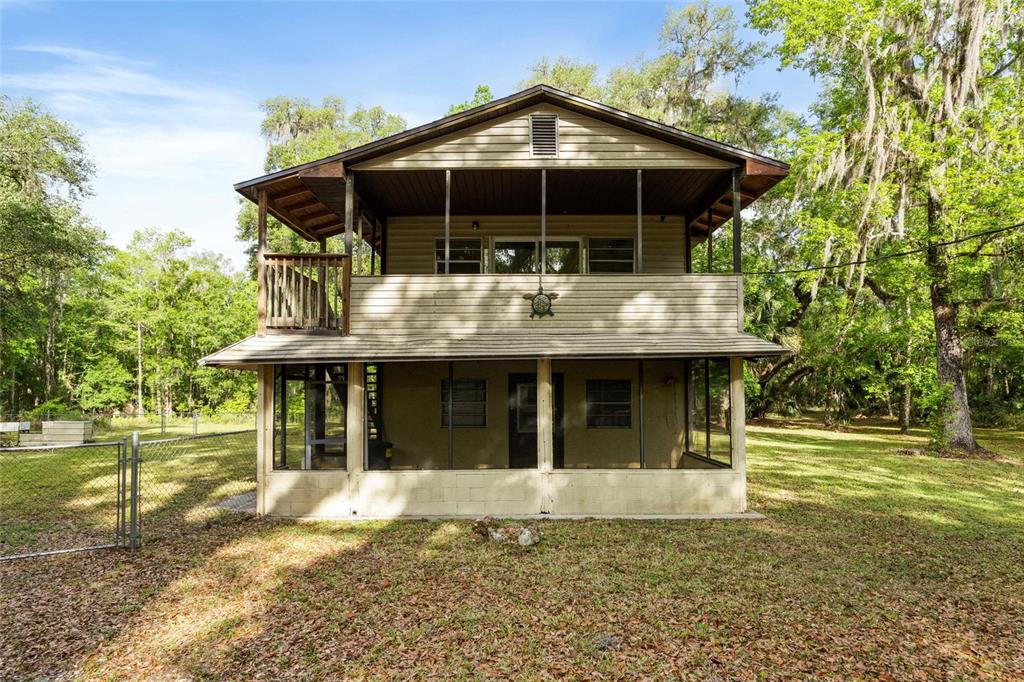 2780 County Road 575 Bushnell, FL 33513 - Photo 3 of 57 a front view of a house with a garden